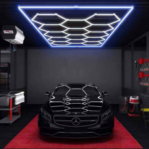 A black car in a garage with 14 Grid LED Hex System - Blue lights.