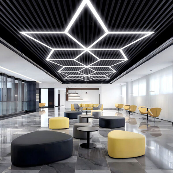 A modern office with yellow and black accents and "Triple Lotus" LED Hex Lights.